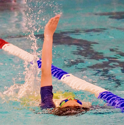 Swimmer swimming backstroke